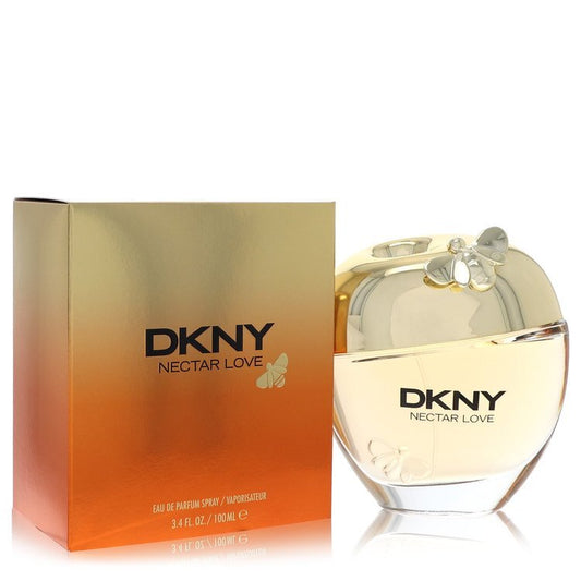 DKNY Be Delicious red perfume bottle with gold cap on white background